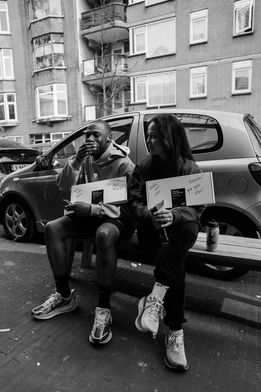 Two runners fuelling up on a bench, notes reading “you got this”